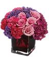 Bouquet di fiori viola, rosa e rossi